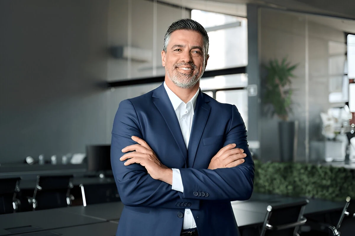 Confident lawyer in blue suit standing in office, lemonmyvehicle