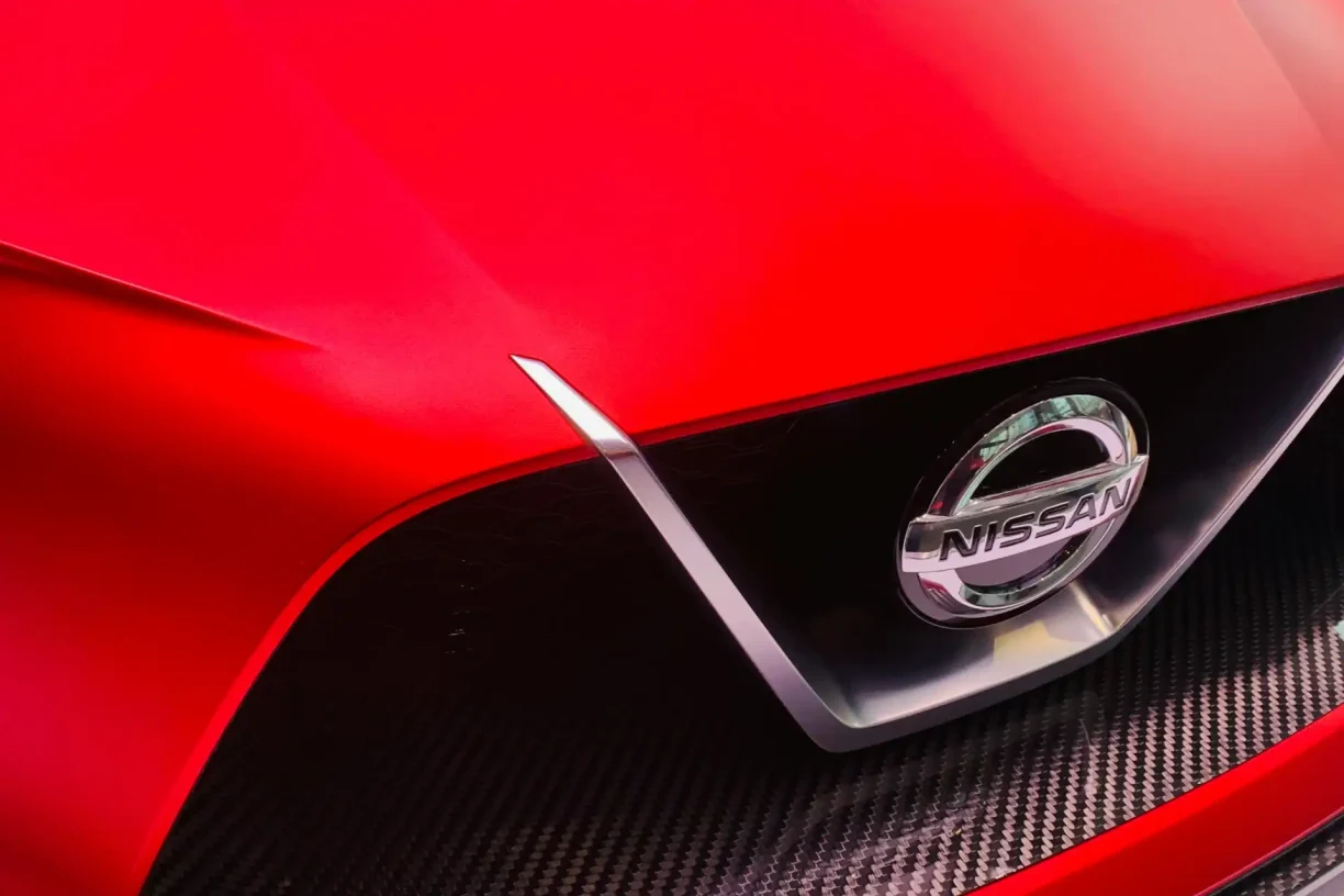 Close-up of a Nissan car logo, representing a vehicle brand relevant to Lemon Law, lemonmyvehicle