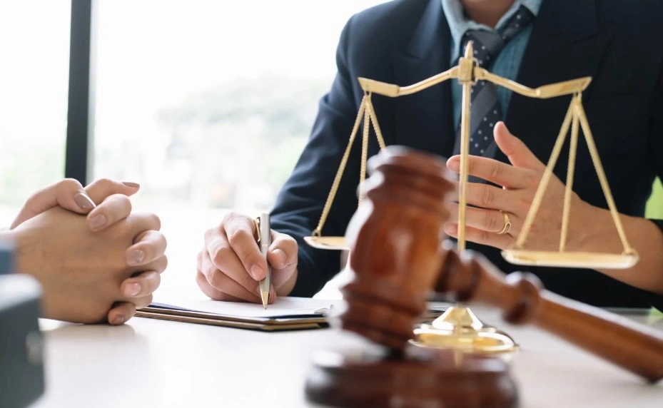 Lawyer discussing lemon law rights and helping a client with their defective vehicle claim at Lemon My Vehicle.