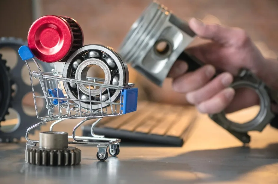 Shopping cart with auto parts representing repairs and replacement for defective vehicles under Lemon Law