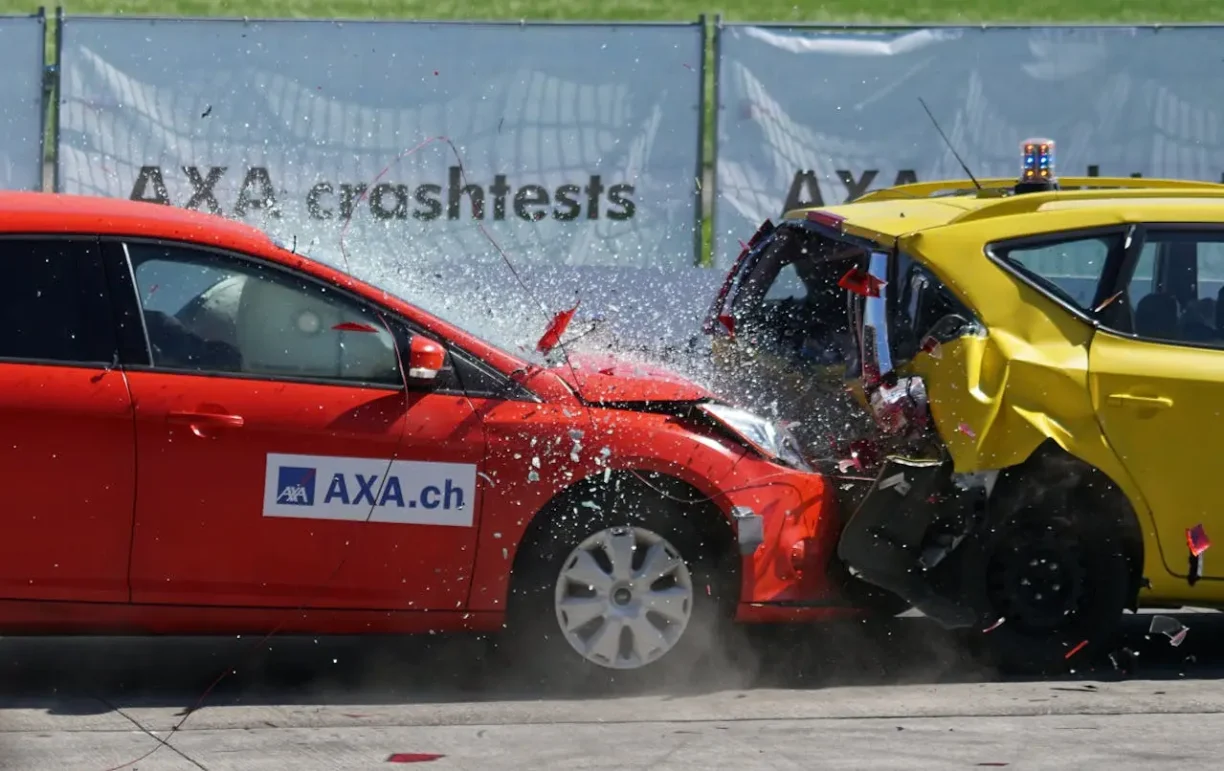 Crash test shows impact damage highlighting risks from defective vehicles.