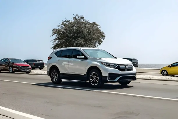 White Honda CR-V driving on highway representing vehicles with lemon law claims