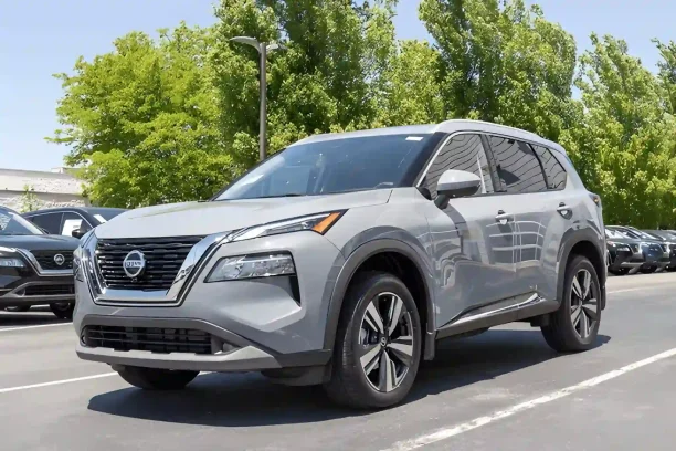 Silver Nissan Rogue SUV parked at dealership lot, lemonmyvehicle