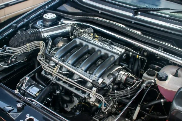 Close view of car engine showing mechanical problems that may qualify for lemon law protection.