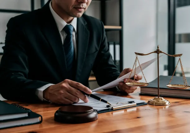 Lemon law attorney reviewing defective vehicle documents to help consumers obtain compensation.