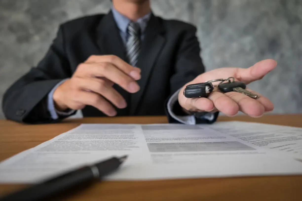 Lemon law attorney handing over car keys after settling a 2022 RAM 1500 problems case