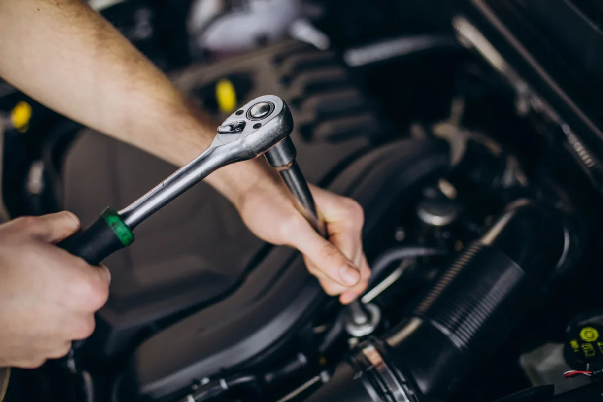 Mechanic performing repeated repairs on a 2023 Hyundai Santa Fe engine qualifying for lemon law claim.